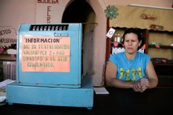 Shopkeeper with cash register